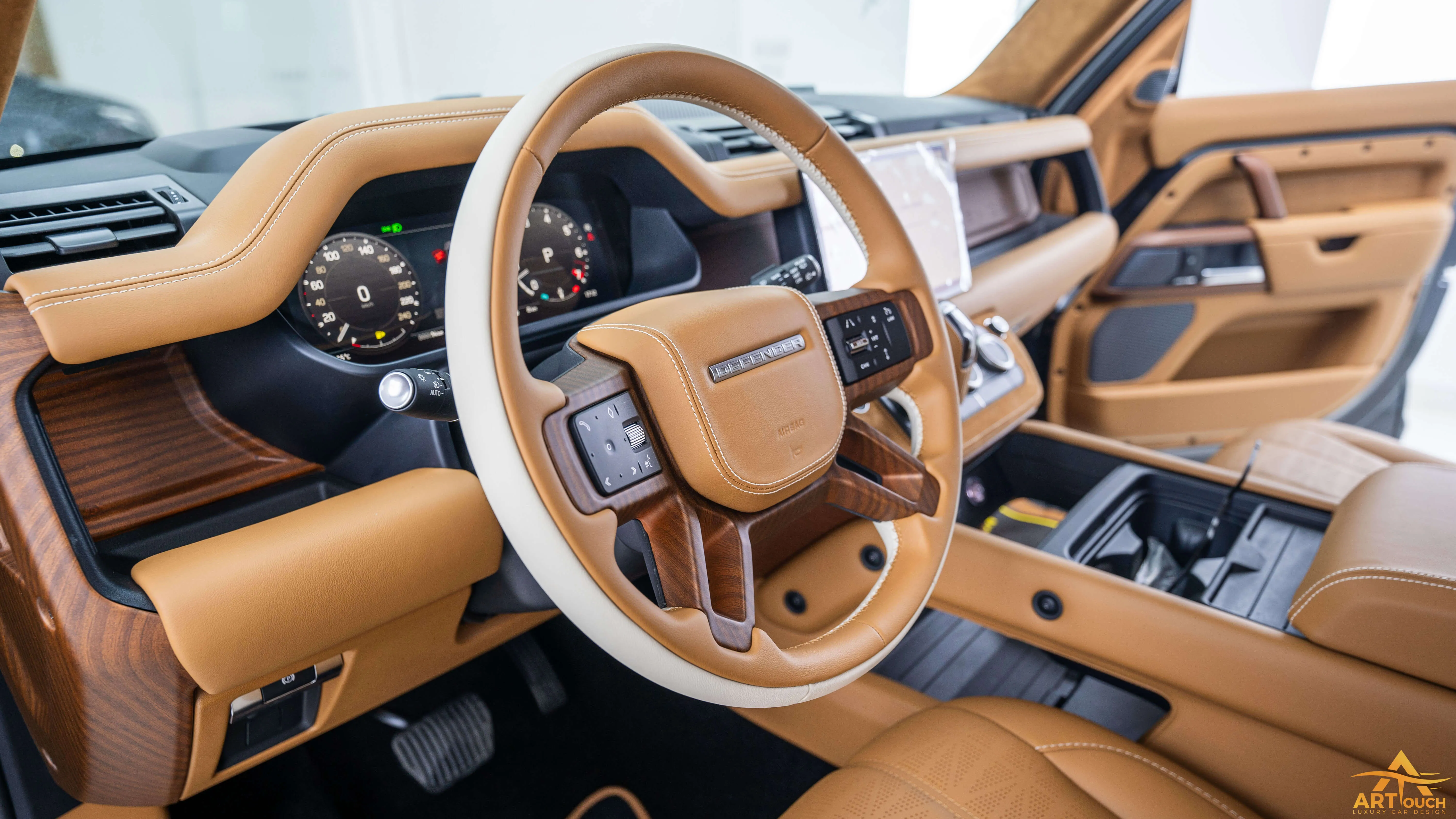Bespoke Defender leather cabin. Premium Alcantara steering, custom gear knobs, and door panels crafted for a supreme luxury feel