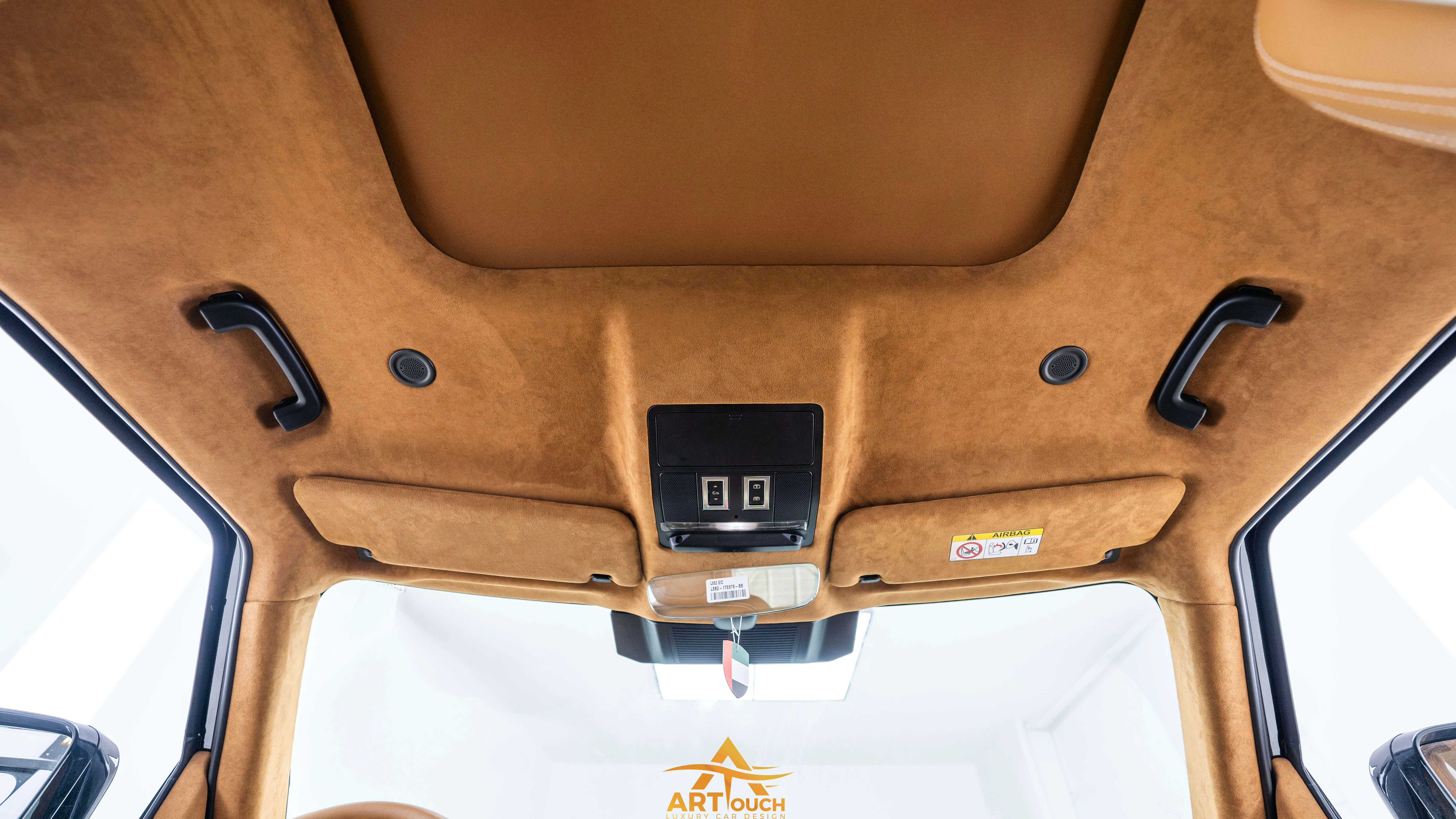 Bespoke Defender leather cabin. Premium Alcantara steering, custom gear knobs, and door panels crafted for a supreme luxury feel