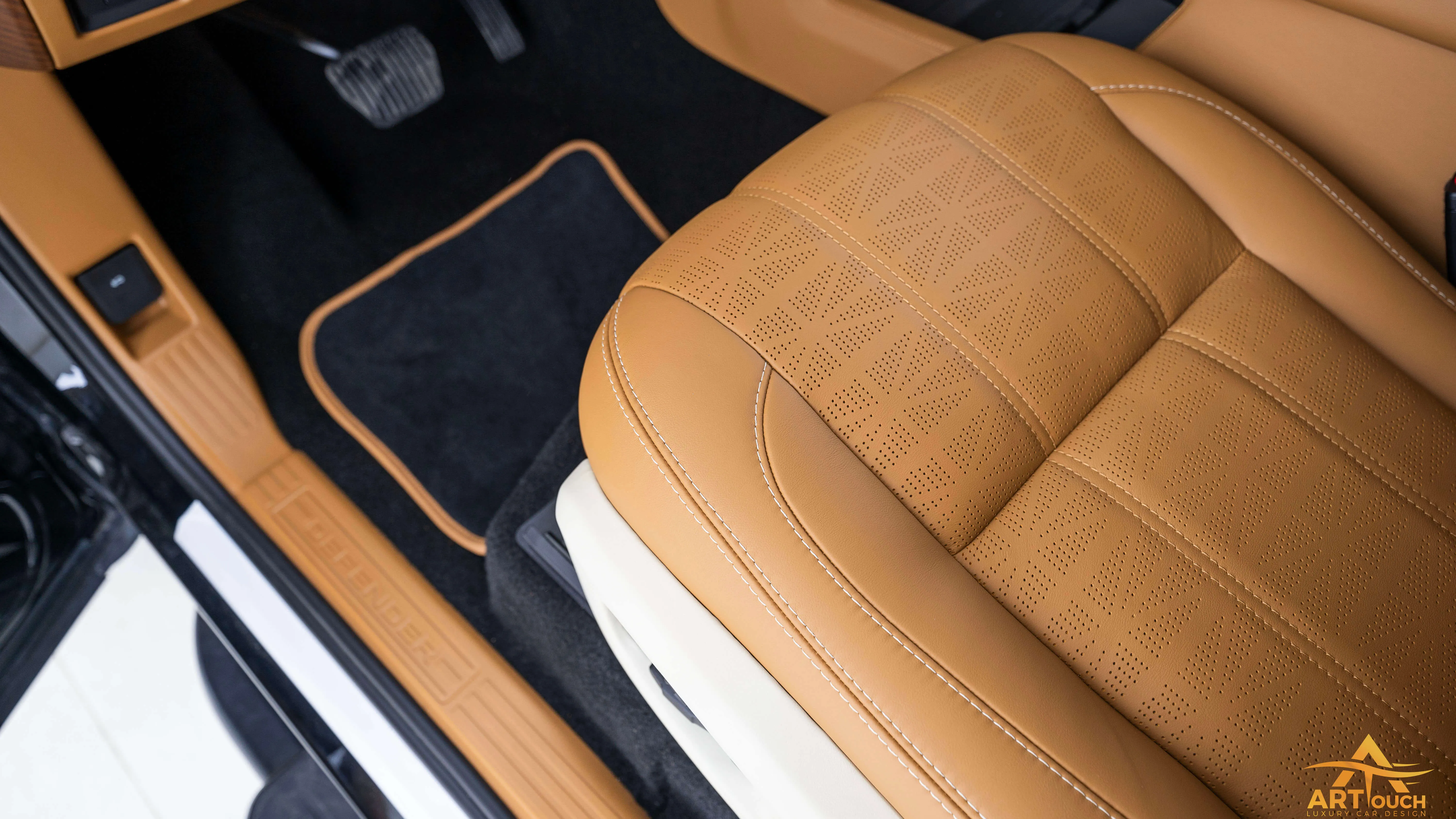 Bespoke Defender leather cabin. Premium Alcantara steering, custom gear knobs, and door panels crafted for a supreme luxury feel