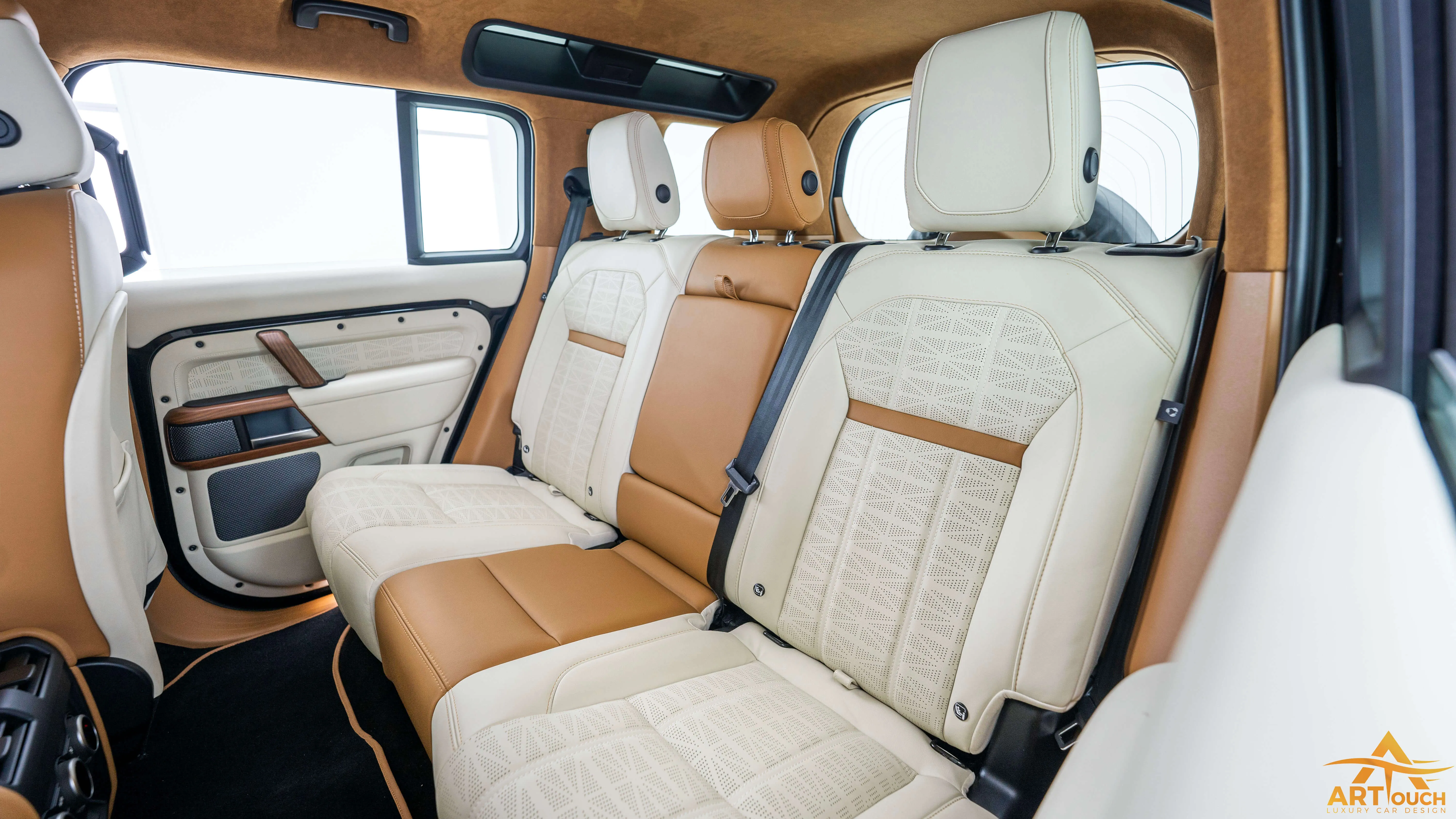Bespoke Defender leather cabin. Premium Alcantara steering, custom gear knobs, and door panels crafted for a supreme luxury feel