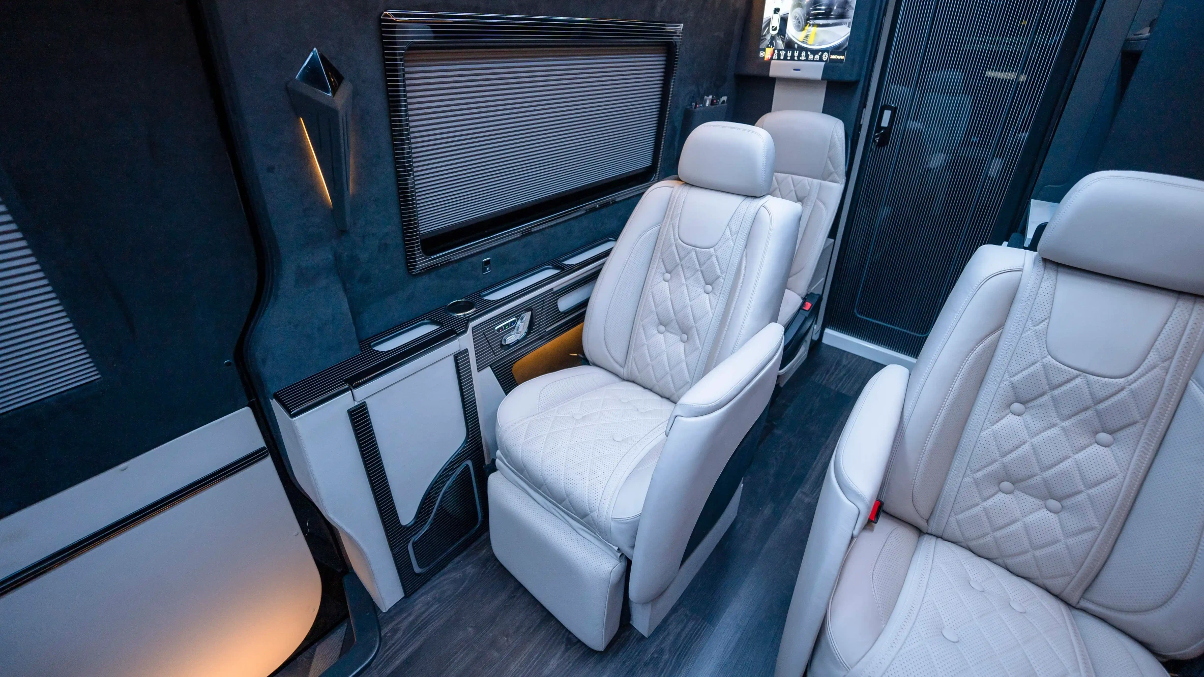 Mercedes Sprinter VIP Interior Upholstery Dubai – Custom White Nappa Leather and Black Alcantara Luxury Cabin Upgrade with Premium Reclining Seats