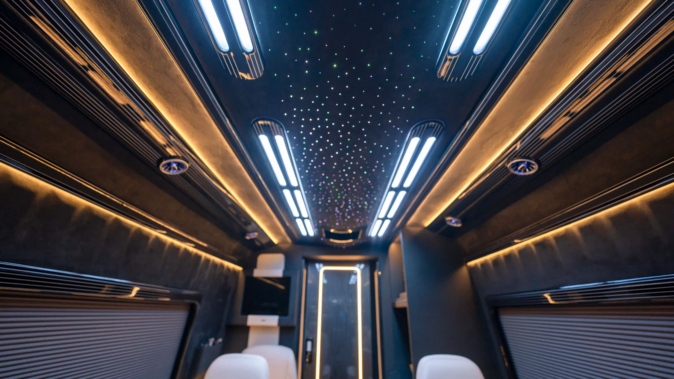 Bespoke Mercedes Sprinter VIP Interior in Dubai featuring White Leather, Black Alcantara, Executive VIP Seating and Luxury Van Customization